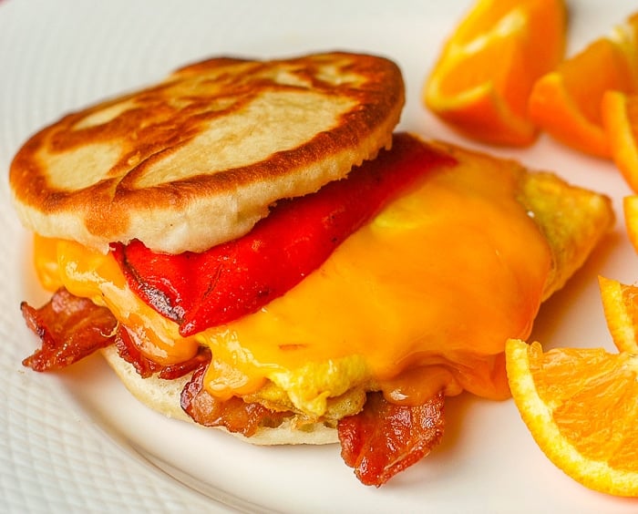 Touton Breakfast Sandwich with egg , bacon, cheese and roasted red pepper.