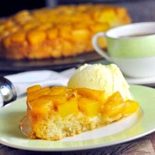 Pina colada upside down cake, photo of a single slice on a green and white plate.
