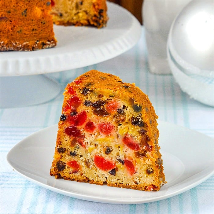 Pineapple Fruitcake single slice shown on white plate