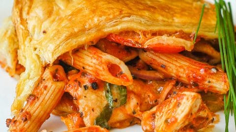 Chicken Penne Timpano close up photo of a single serving on a white plate