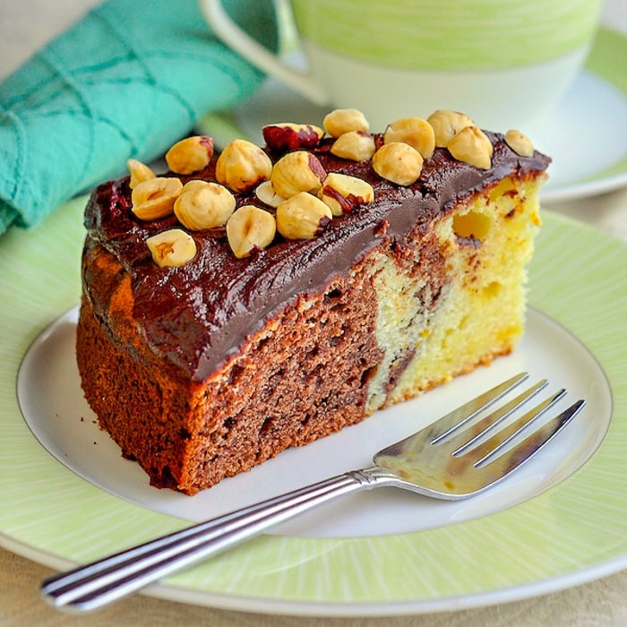 Chocolate Grand Marnier Sour Cream Coffee Cake close up photo of single slice on a green plate