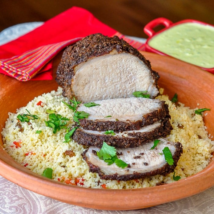 Indian Spiced Roast Pork front view of sliced roast on couscous