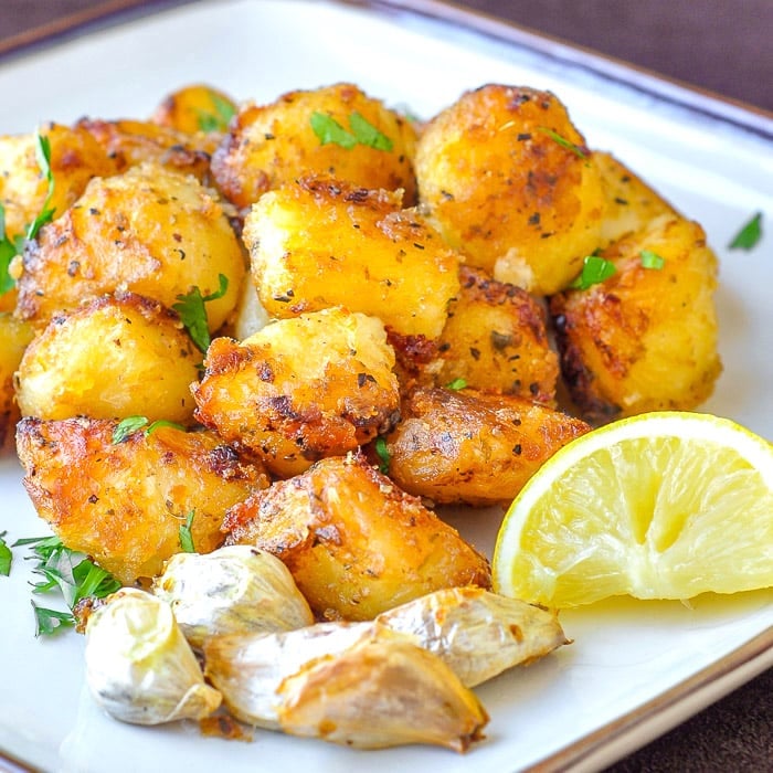 Lemon Herb Roasted Potatoes on cream coloured plate