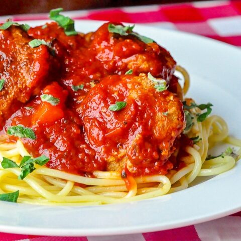 Low Fat Smoky Barbecue Turkey Spaghetti and Meatballs close up image on white plate