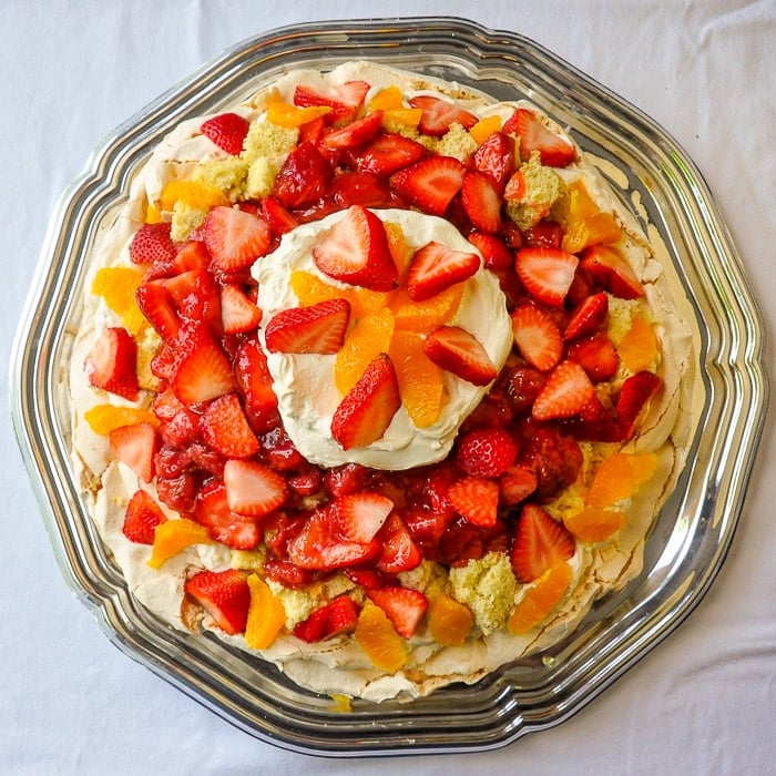Orange Strawberry Pavlova Shortcake overhead shot on silver platter