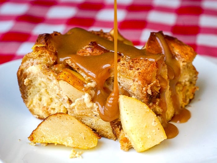 Spiced Pear Bread Pudding photo with butterscotch sauce being pored on