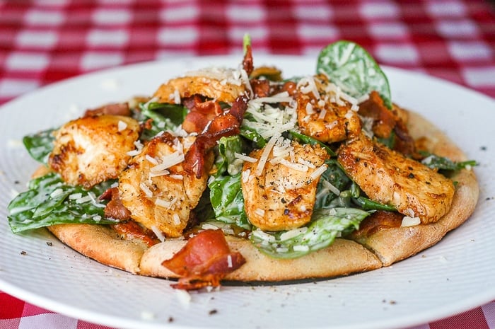 Spinach Caesar Salad on a honey oatbran pizza base