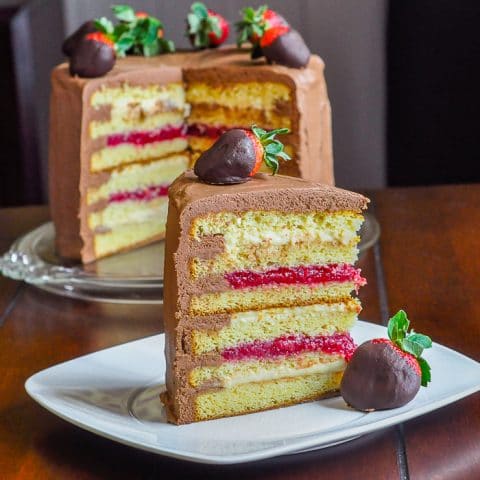 Too Tall Neapolitan Cake photo of a single slice with full cake in the background