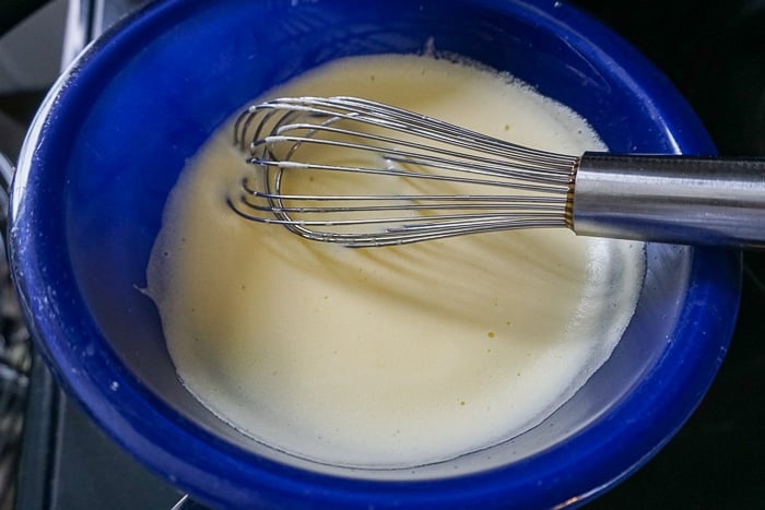 Whip the yolks, sugar and water until slightly foamy