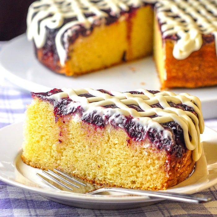 Cherry Vanilla Coffee Cake close up photo of a single slice on a white plate