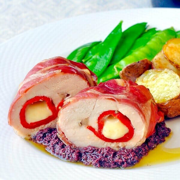 Prosciutto wrapped stuffed chicken breast.