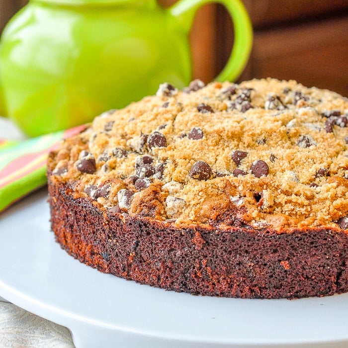 Date Coffee Cake with Chocolate Chip Streusel image of whole cake on white serving plate