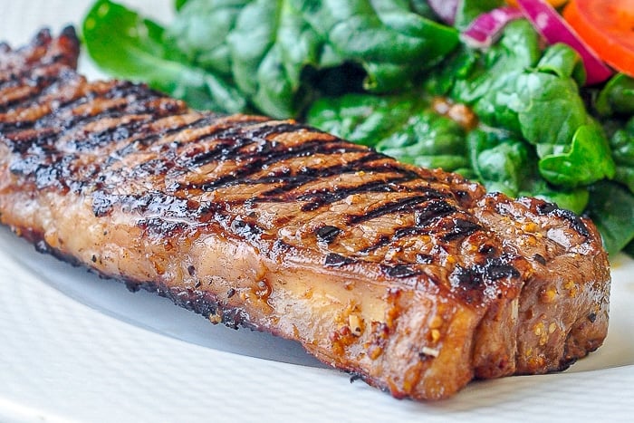 Dijon Balsamic Marinated Steak close up photo of cooked steak