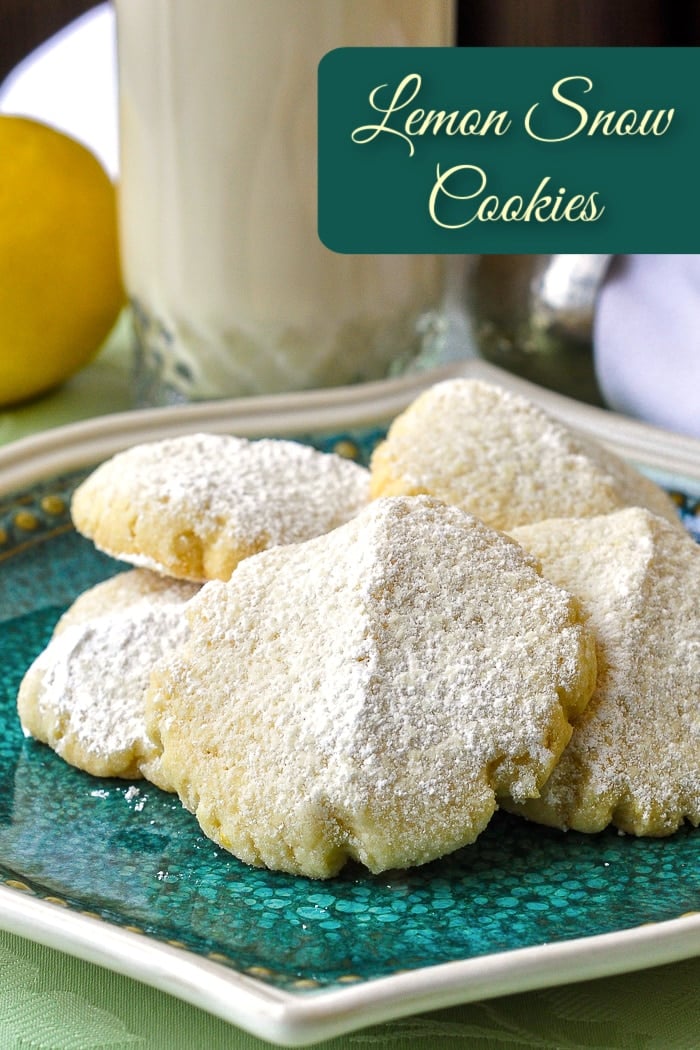 Lemon snow cookies on a green plate with title text added for Pinterest