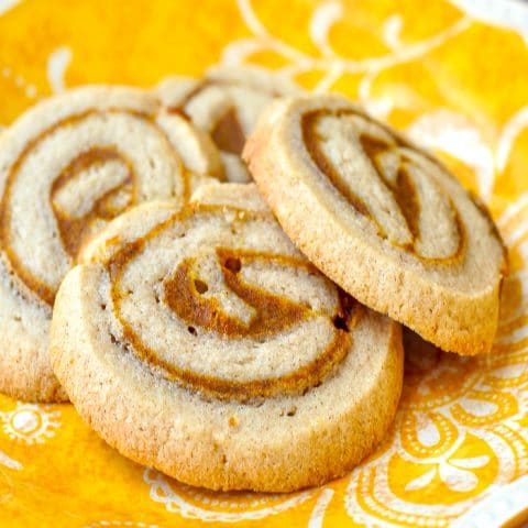 Pumpkin Pie Pinwheel Cookies close up of cookies on a yellow plate
