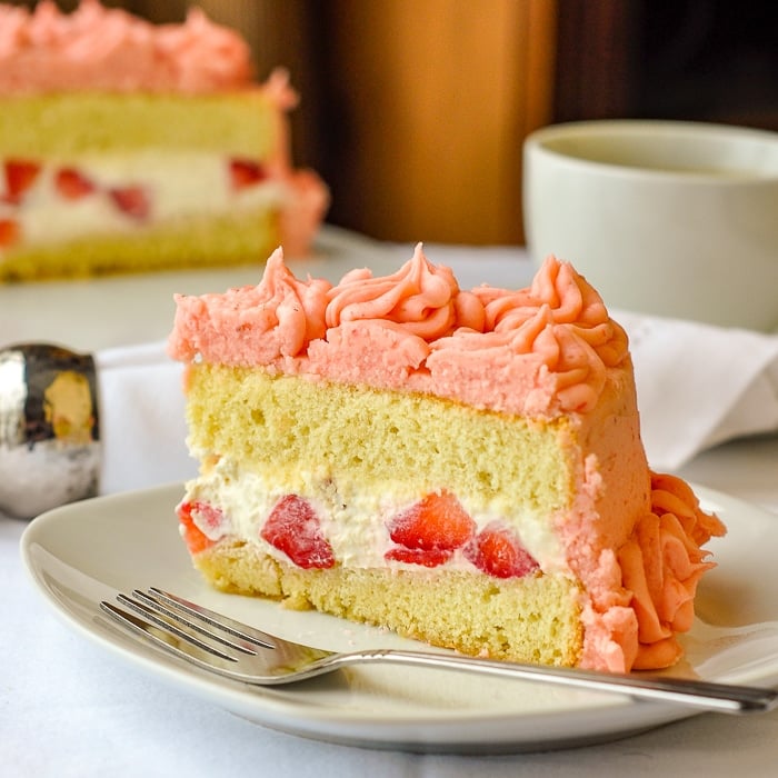 https://www.rockrecipes.com/wp-content/uploads/2013/03/Strawberry-Mascarpone-Cream-Cake-close-up-photo-of-single-slice-on-a-white-plate.jpg