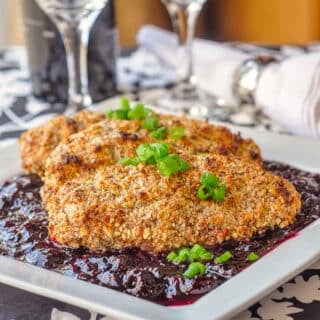 Almond Chicken with Sweet and Sour Cherry Sauce shown on white serving platter