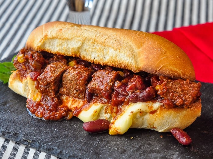 Chipotle Meatloaf Chili shown on a sub roll as sloppy joes