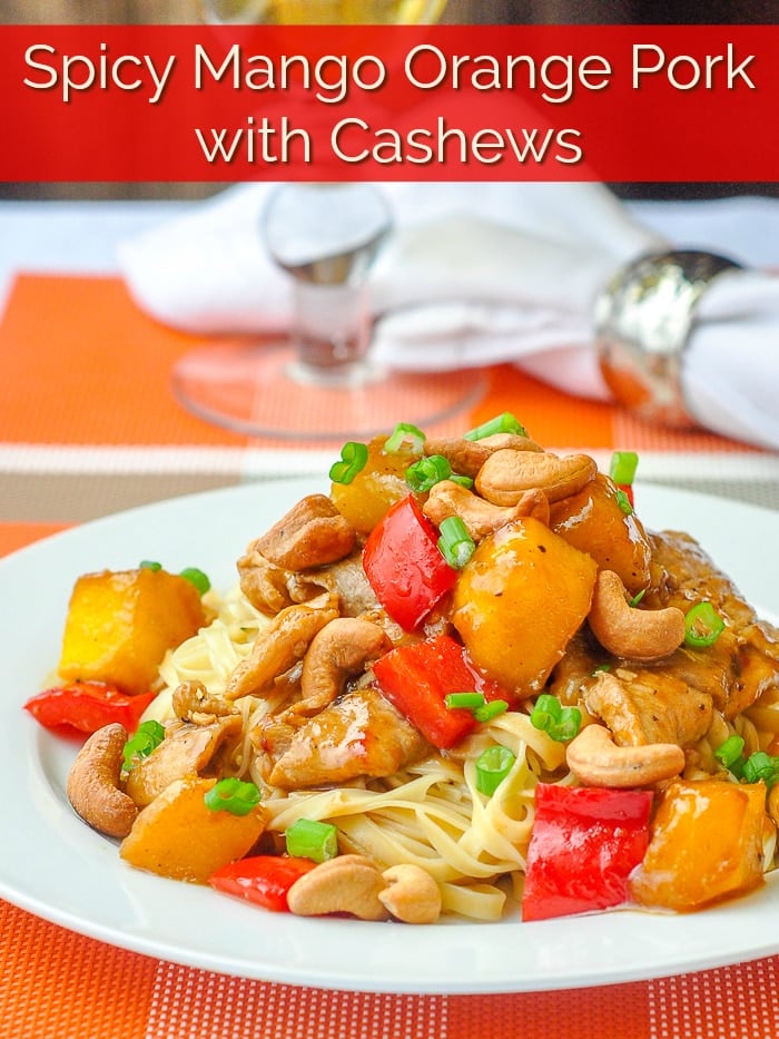 Spicy Mango Orange Pork with Cashews image with title text for Pinterest