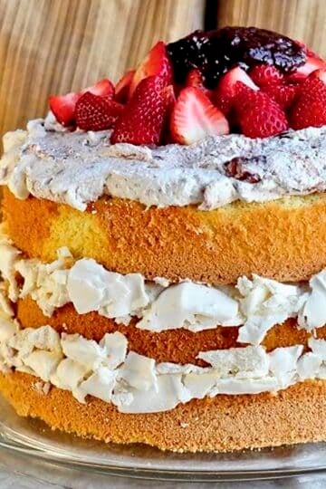 Strawberry Fool Pavlova Cake close up photo of uncut cake for featured post image