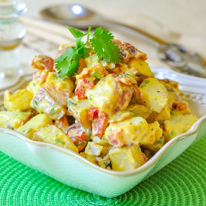 Bacon Potato Salad with Sweet Mustard Dressing in a cream coloured serving bowl