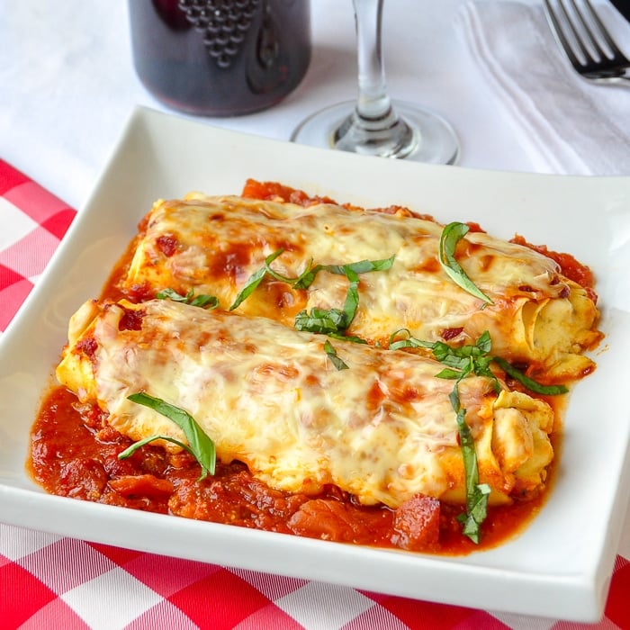 Chicken Cannelloni Margherita featured image on white plate.