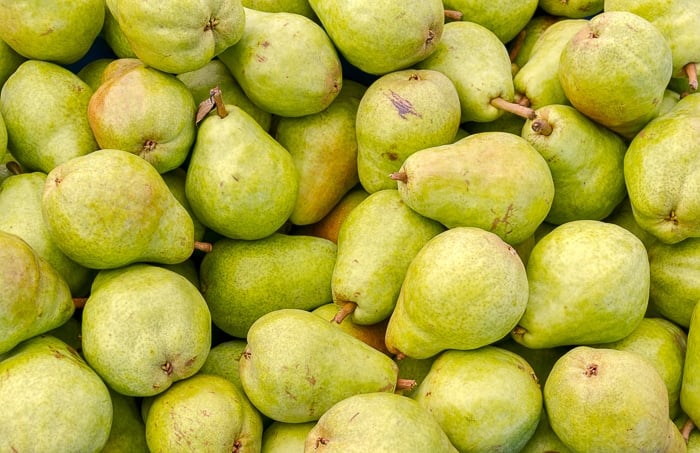 Freshly picked green Bartlett pears on display at the farmer's market