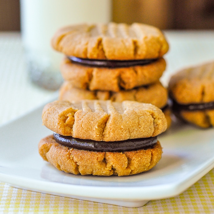 3 Ingredient Gluten Free Peanut Butter Cookies shown with chocolate filling on a white plate