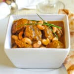 Easy Chicken Korma pictured in a white serving bowl