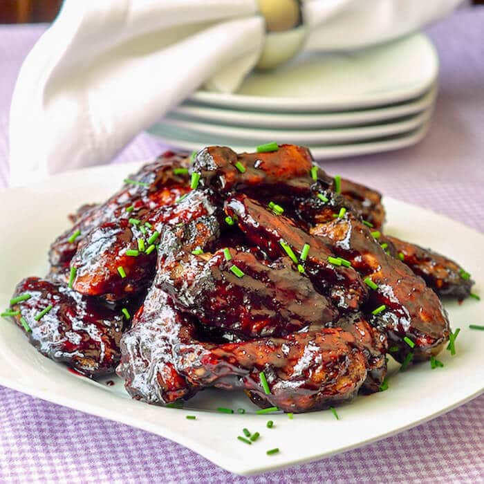 Honey Blueberry Barbecue Wings on a white serving platter
