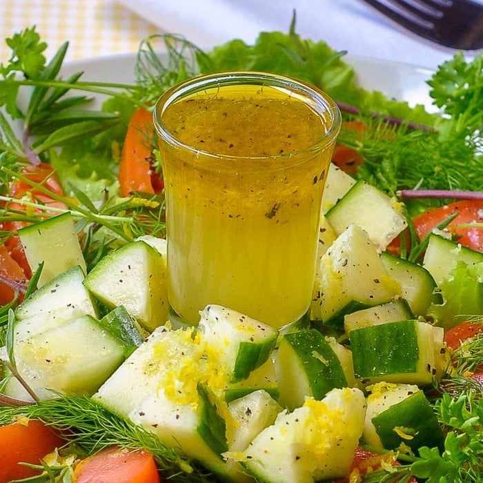 Lemon Herb Garden Salad featuring Lemon Honey Salad Dressing close up image of salad dressing