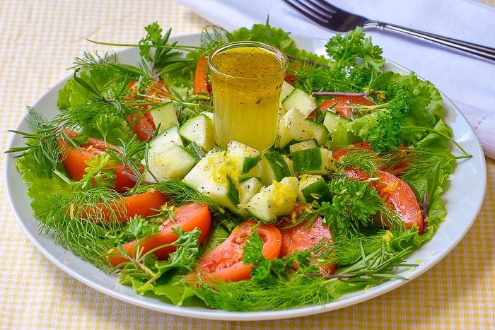 Lemon Herb Garden Salad featuring Lemon Honey Salad Dressing photo of full serving on a white plate