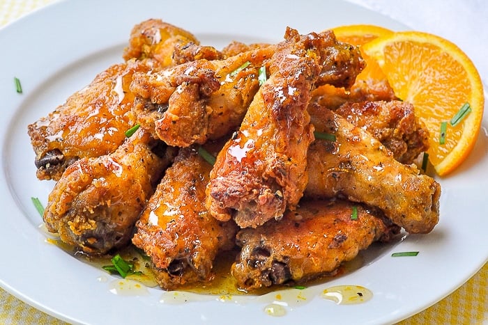 Baked Southern Fried Chicken Wings with Orange Honey Drizzle wide shot of full plate of wings