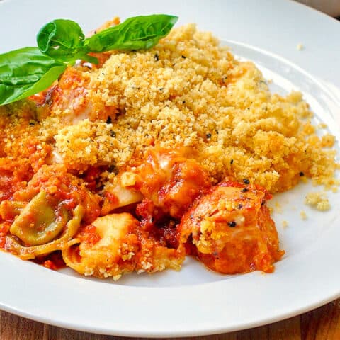 Cheesy Tomato Basil Baked Tortellini with Parmesan Pepper Crumb Topping close up photo