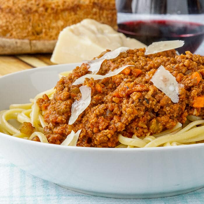 The Best Bolognese Sauce in bowl with linguine. Square image.
