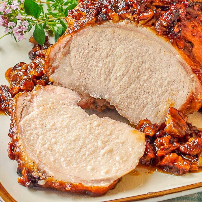 Pecan Glazed Brown Sugar Pork Loin close up photo of sliced pork roast