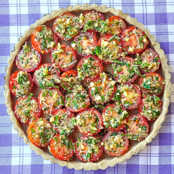 Photo of unbaked tomato parmesan tart ready for the oven
