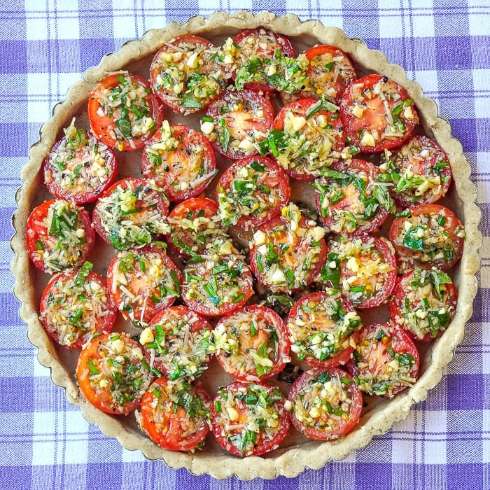 Photo of unbaked tomato parmesan tart ready for the oven