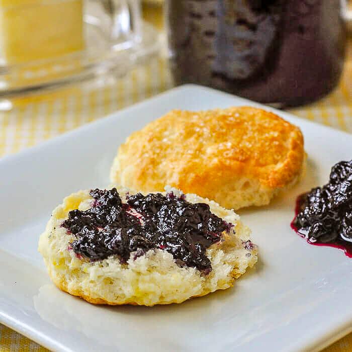 Sour Cream Lemon Scones close up photo spread with wild blueberry jam