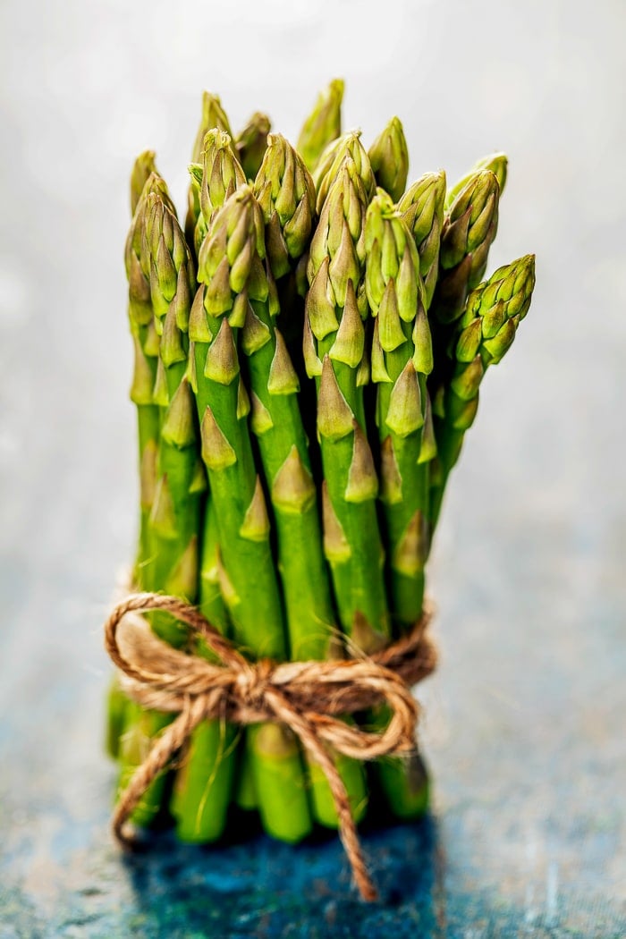 Bunch of fresh asparagus on wooden table