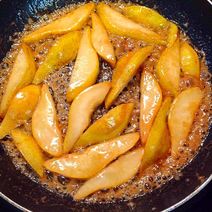 Caramelizing the pears for pear prosciutto pizza.