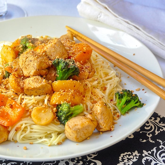 20 minute Honey Sriracha Chicken and Noodles close up photo of a single serving on a white plate