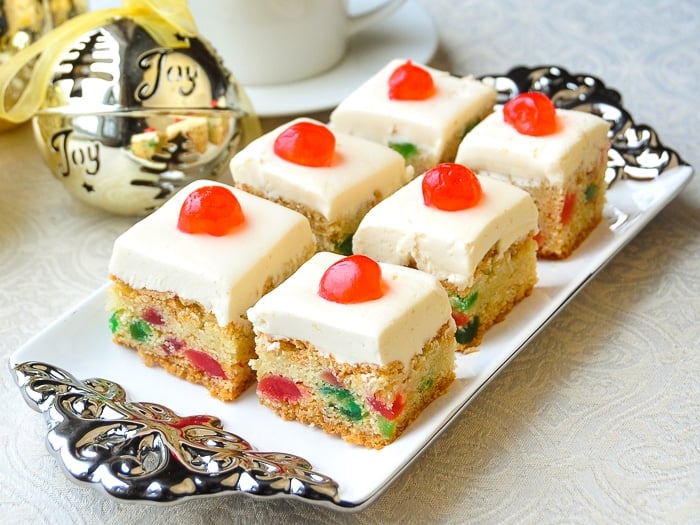 Cherry Cake Squares shown on a silver and white platter