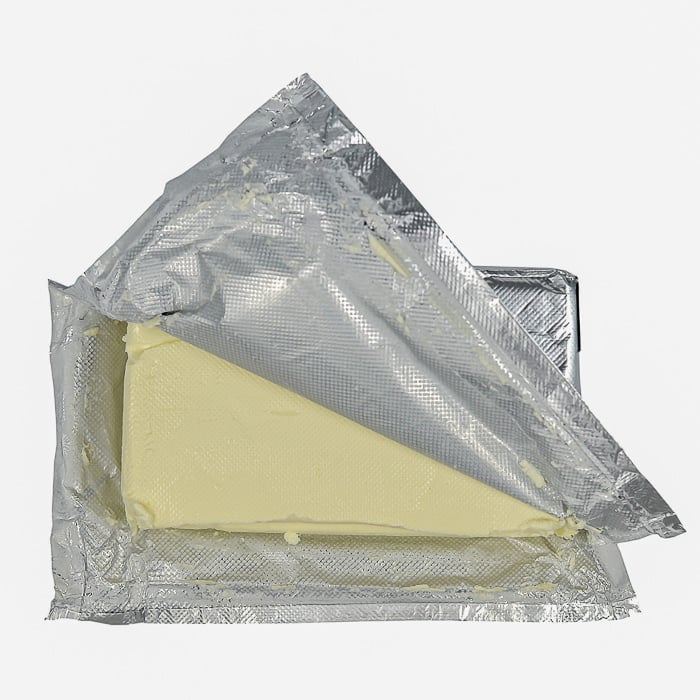 Stock photo of cream cheese in a foil package.