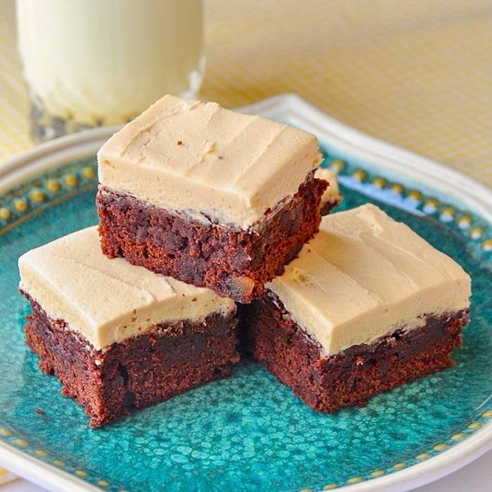 Gingerbread Brownies with Brown Butter Frosting close up photo on a green pattern plate