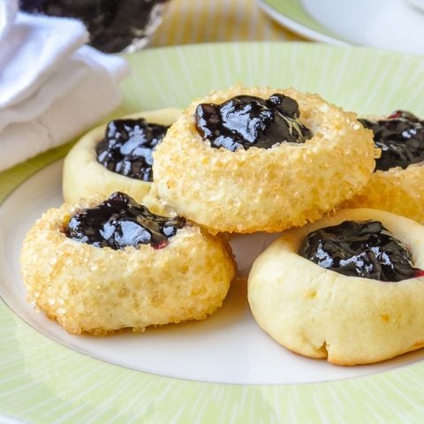 Lemon Blueberry Thumbprint Cookies close up photo on green and white plate