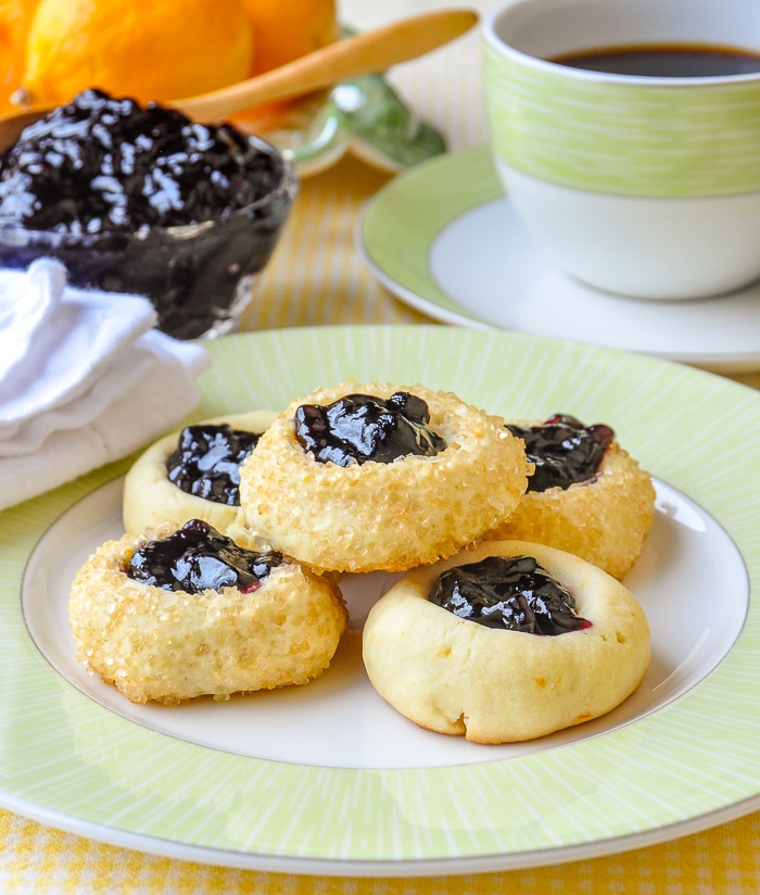 Lemon Blueberry Thumbprint Cookies with coffee on a green and white tea service