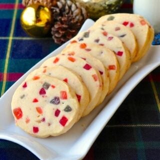 Tutti Frutti Shortbread Cookies, shown on a white plate against Newfoundland tartan background.