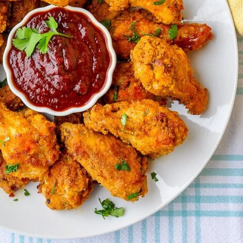 Oven Baked Wings with Honey Molasses Barbecue Sauce close up photo on white plate