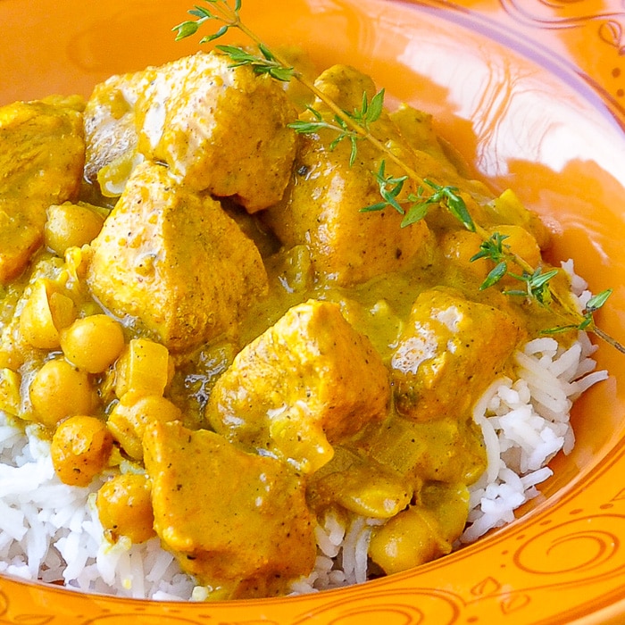 30 minute Easy Chicken Chickpea Curry close up photo with rice in orange pattern bowl